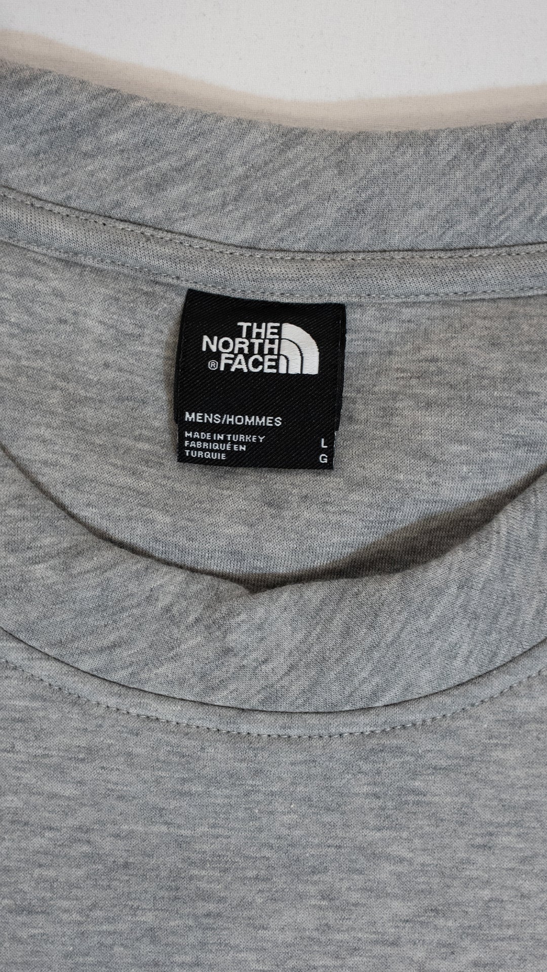 The North Face Sivi Duks sa Crnim Gumenim Logom