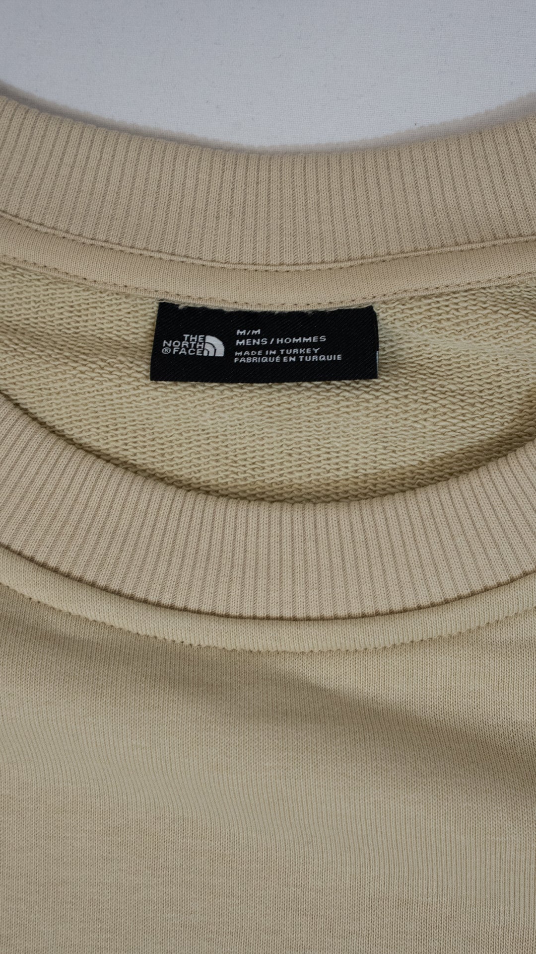 The North Face Bež Duks sa Džepicem i Belim Detaljom na Rukavu