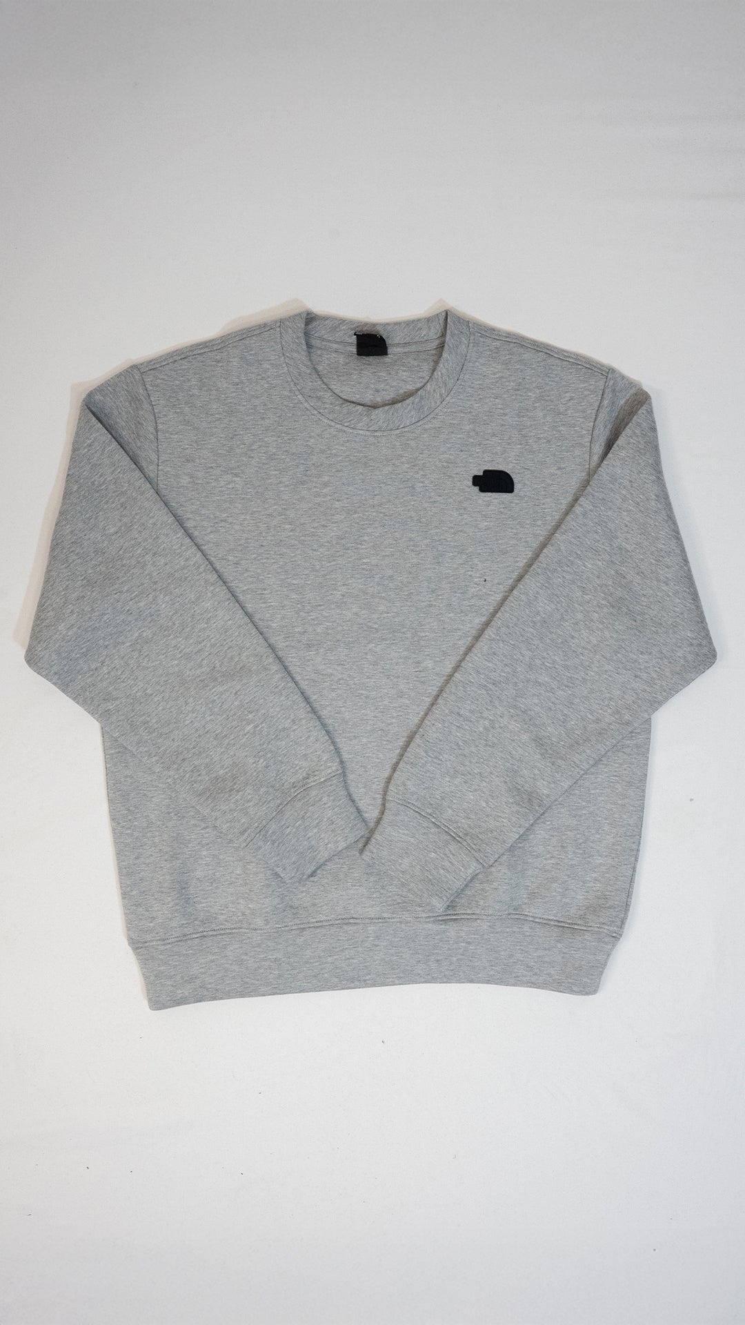 The North Face Sivi Duks sa Crnim Gumenim Logom