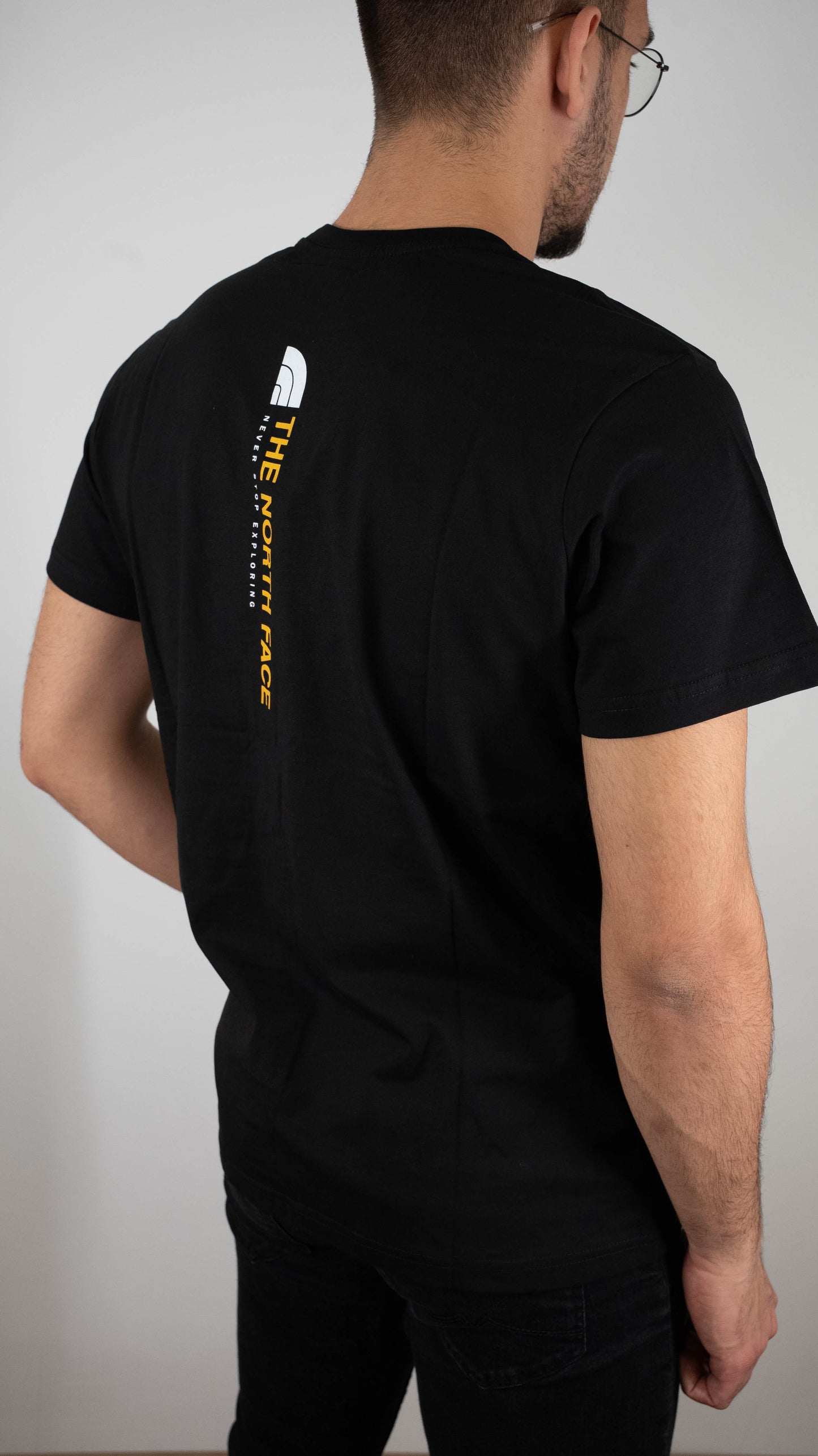 The North Face Crna Majica sa Vertical Printom na Leðima